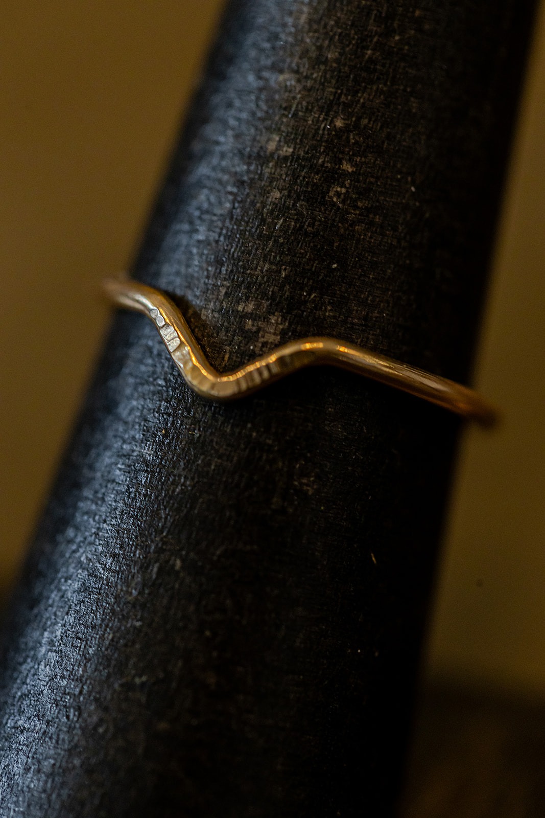 14kt Gold Filled stacking ring in chevron shape with delicate intentional hammered marks for accent handmade in buffalo New York by Good Form Jewelry